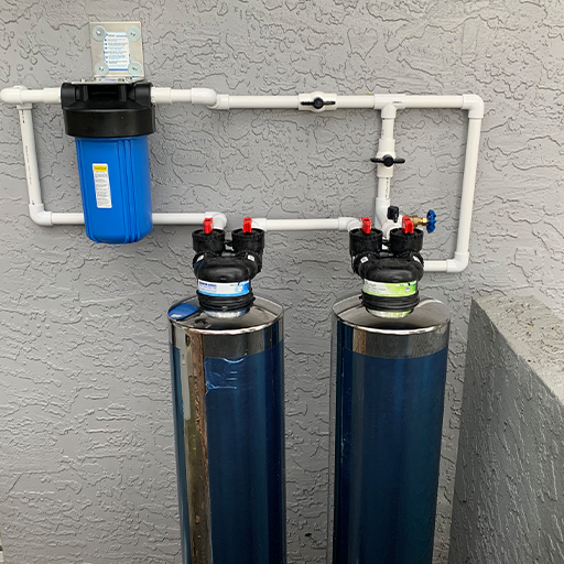 blue water softener installed on house